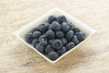 Sweet ripe blueberry heap in the bowl