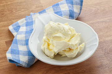 Italian soft mascarpone cheese in the bowl