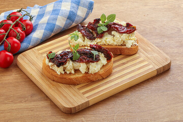 Bruschetta with soft cheese and tomato