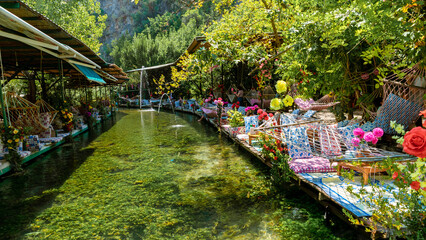 Saklikent Turkey , Colorful Restaurant in the river near the famous Canyon is about 300 m deep and...