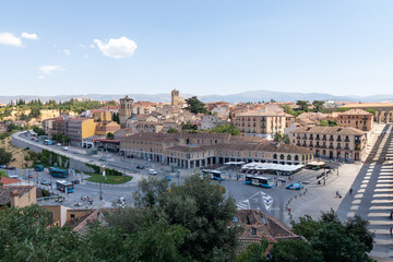 Ancient Roman aqueduct on Plaza del Azoguejo square and old building towns in Segovia, Spain