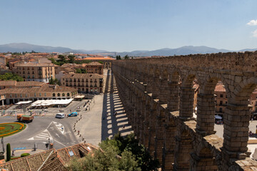 Segovia town view at Plaza del Azoguejo and the ancient Roman aqueduct. Spain 