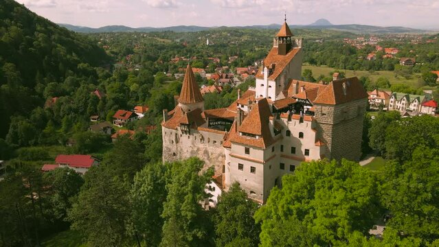 Aerial video of Bran castle, located in Brasov, Romania. The footage is shot from a drone while flying forward at close proximity over the castle walls between the towers. 
