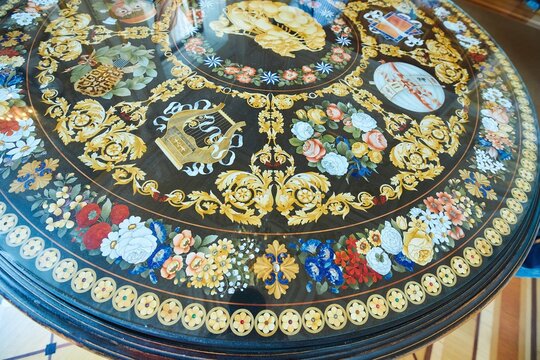 St. Petersburg, Russia - May 27, 2021: Hermitage Museum, table inlaid with wooden and stone details. Pattern. Palace interior details.