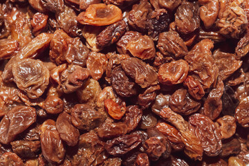 Raisins close up background. dried grapes