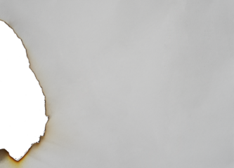 burnt paper frame for texture overlay. damaged white paper with burnt stain in transparent background. blank ripped paper edge for a design element.