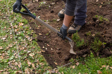 man moving soil with a shovel in an archaeological dig, working concept