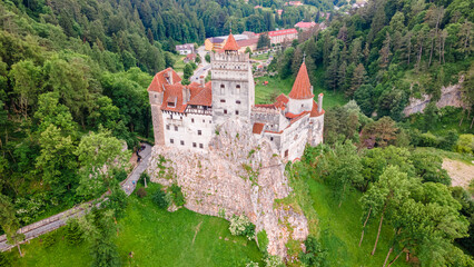 Obraz premium Aerial photography of the front of Bran castle in Brasov, Romania. Photography was shot from a drone at a higher altitude with camera pointing downwards for a top view.