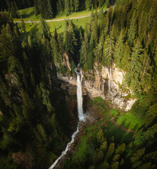 Beautiful waterfall shot by drone called Johanneswasserfall in Austria near to Obertauern during sunset