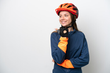 Young cyclist Lithuanian woman isolated on white background pointing to the side to present a product