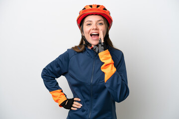 Young cyclist Lithuanian woman isolated on white background shouting with mouth wide open