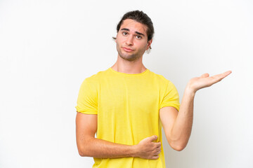 Caucasian handsome man isolated on white background having doubts