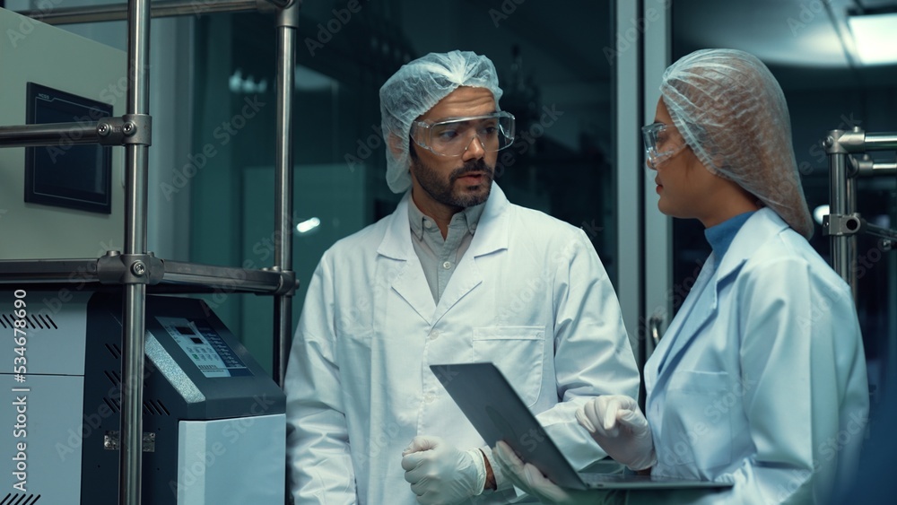 Poster two scientist in professional uniform working in laboratory for chemical and biomedical experiment