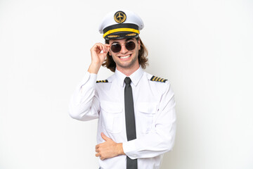 handsome Airplane pilot isolated on white background with glasses and happy