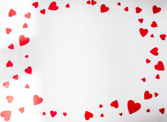 White background with red hearts around the edges. Valentine's Day card. Copy space for text. Flat lay, top view, copy space. Design for text.
