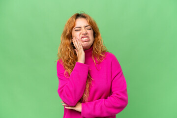 Young caucasian woman isolated on green screen chroma key background with toothache