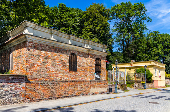 Entrance of ruined renaissance and baroque historic castle complex with palace and garden in old town quarter of Pilica in Silesia region of Poland