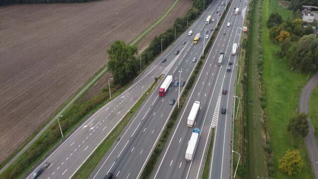 Drone Aerial View Of Traffic At A Highway Ramp And Cars Merging Into Motorway Lane In Antwerp, Belgium