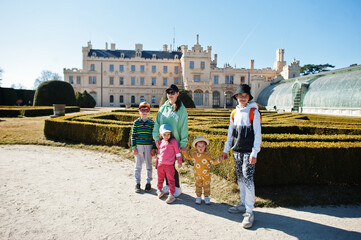 Obraz premium Mother with four kids at Lednice castle park, Czech Republic.