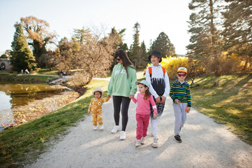 Fototapeta premium Mother with four kids at Lednice park, Czech Republic.