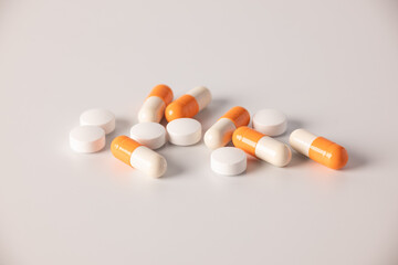 Tablets, medications on a white background, a scattering of tablets