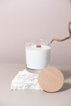 Candle In A Jar With A White Label With A Wooden Lid