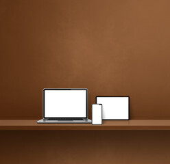 Laptop, mobile phone and digital tablet pc on brown wall shelf. Square background