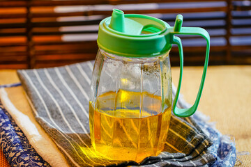 Transparent cooking oil on kitchen table