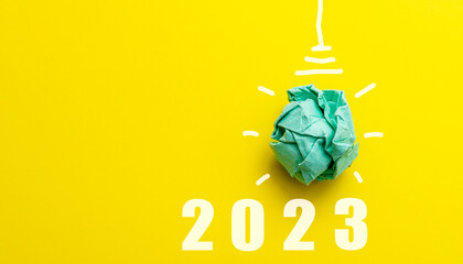 2023 Green paper bulb, new year's vision and innovative business resolution concept, renewable and sustainable energy © ciprian