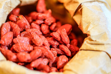 There are many naturally dried red wolfberries on the table