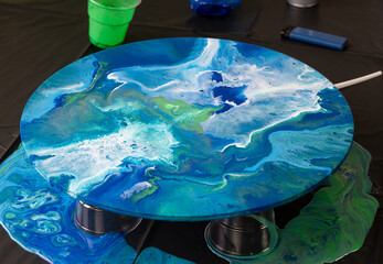 picture that was painted with epoxy resin in blue and green shades