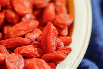 There are many naturally dried red wolfberries on the table