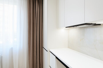 white new clean kitchen in the house. furniture with lighting
