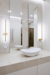 Naklejka na ściany i meble water sink with mirror and lighting in the bathroom