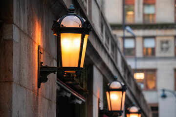 Vintage light lamps on a facade of an old architecture building