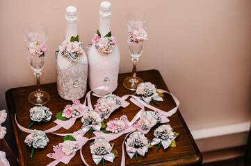 Two empty glasses and champagne bottle decorated flowers. Women's Day, 8 March. Valentine's Day. Birthday. Wedding. Anniversary. Rustic style.