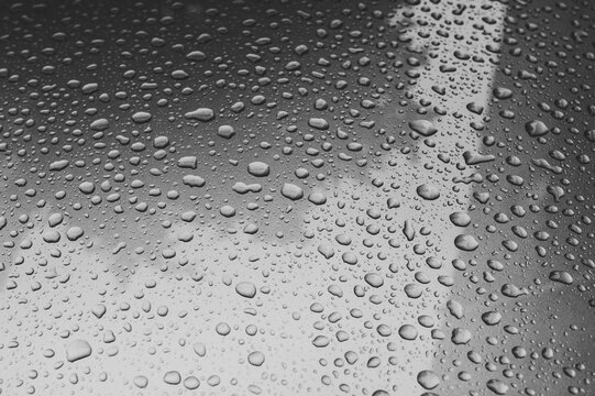 Condensation on the clear glass window. Water drops. Rain. Abstract background texture. Water drops on window glass. Close up.