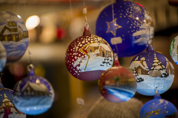 Advent Bazaar Stalls with glass, wooden, ceramic christmas souvenirs in shops. Close up of festive...
