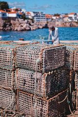traditional lobster pots on the dock in Cascais Lisbon Portugal