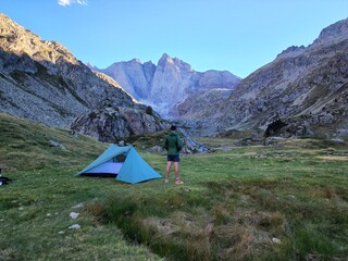 Hiker camping with tent in the mountains