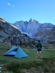 Hiker camping with tent in the mountains
