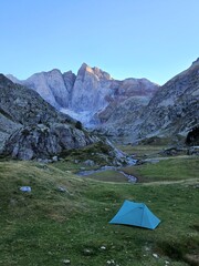 Camping tent in the mountains by a lake