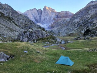 Camping tent in the mountains by a lake