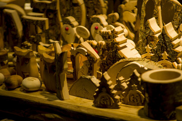 Advent Bazaar Stalls with glass, wooden, ceramic christmas souvenirs in a shop. Close up of festive...
