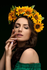 Portrait of a Ukrainian girl in a wreath of colorful yellow sunflowers. National traditional flower headdress. Ukraine concept. Stop war