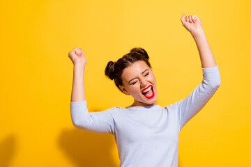 Photo of positive cheerful delighted lady raise fists up celebrate lucky triumph isolated shine...