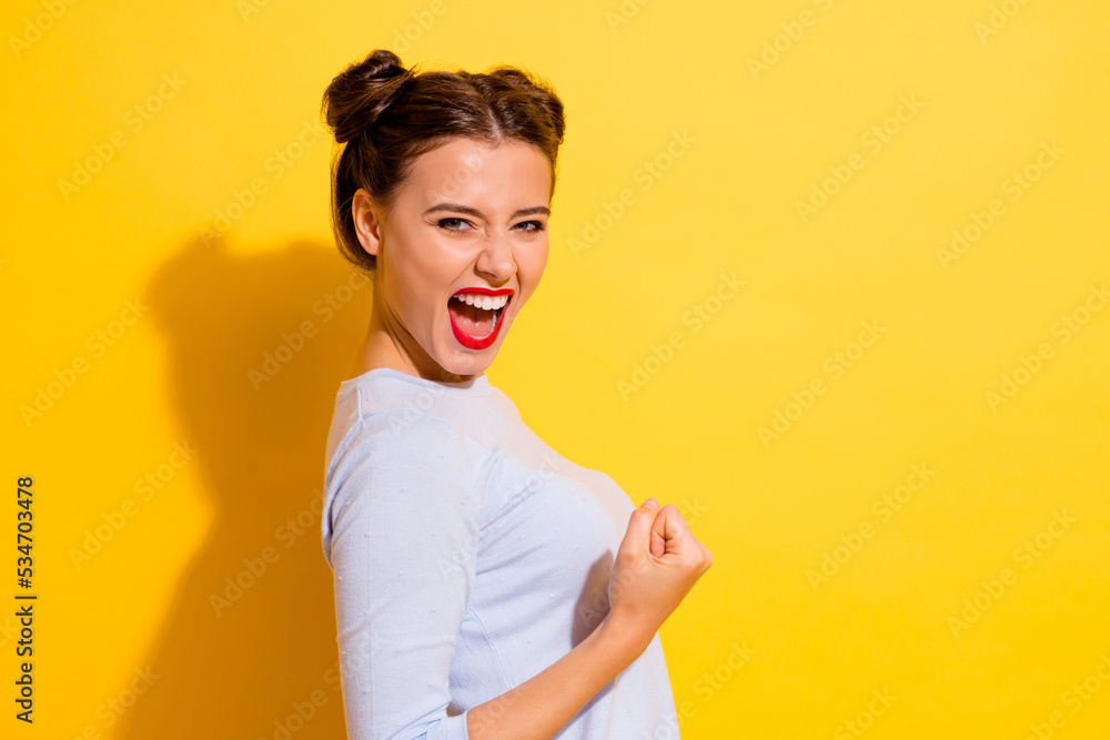 Wall mural Profile side photo of delighted lady achieve luck goal fist up gesture scream yeah loud isolated shine color background