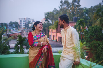 South asian hindu religious newly married young couple having post wedding chill .  