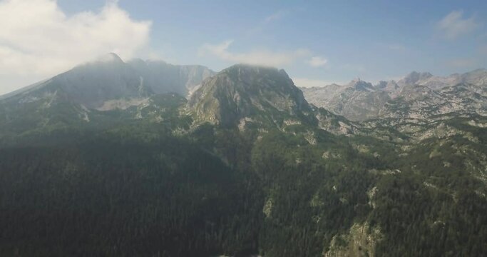Most famous Durmitor national park in Montenegro. Iconic Black Lake and mountains in the background are absolutely stunning. Adventure landscape of Crna Gora. Aerial 4k footage for travel content.