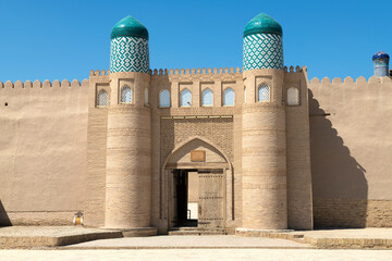 The gate of the ancient fortress of Kunya Ark close-up on a sunny day. The inner city of Ichan-Kala. Khiva, Uzbekistan
